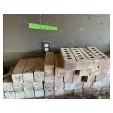 BRICKS AND THINGS ON BENCH TOP