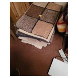 Stack of Rectangular Area Rugs in Earth Tones