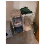 Wire Storage Cube Shelving With Assorted Linens