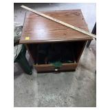 Wooden Cabinet with Bottom Drawer Containing Rags