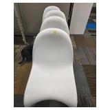 Four White Molded Plastic Chairs