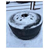 Stack of Heavy-Duty Tires with Rims