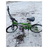 Green BMX-Style Bike With Pegs