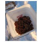 Bucket of Tire Chains in Metal Bucket
