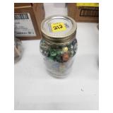 Glass Jar Containing Colorful Marbles