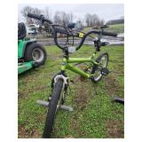 Green BMX-Style Bicycle with Pegs