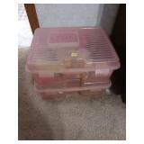 Two Pink Storage Containers With Contents