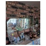 Mirror Above Fireplace with Gilt Details