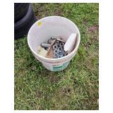 Bucket of Metal Pipe Fittings
