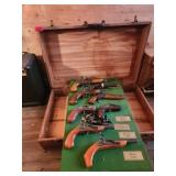 7 Replica Flintlock Pistols in Case