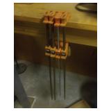 Four Bar Clamps with Orange Jaws