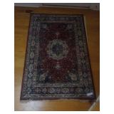 Rectangular Patterned Area Rug with Red Border