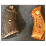 Two Gun Grips With Brass Emblems