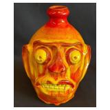 Glazed Ceramic Face Jug with Yellow Eyes