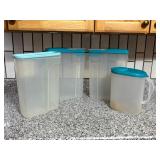 Four Plastic Storage Containers