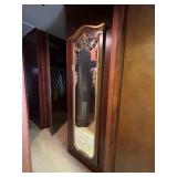 Wall-Mounted Mirror With Ornate Gold Frame