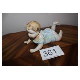Large Bisque Reclining Piano Baby