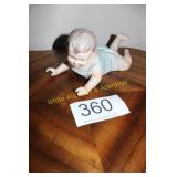 Large Bisque Reclining Piano Baby