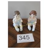 Pair of Large Bisque Porcelain Piano Babies
