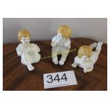 Trio of Bisque Porcelain Blond Piano Babies