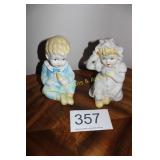 Pair of Seated Porcelain Toddler Figurines