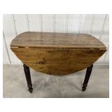 Wooden drop leaf table  52.5" x 42" x 29"..