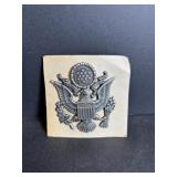 United States Military cap badge featuring the ...
