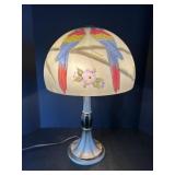 Frosted table lamp featuring parrots - works