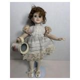 Bisque porcelain doll - left shoe missing..