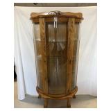 Lighted oak curio cabinet with 3 glass shelves....