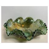 Ruffled edge emerald green carnival glass bowl..