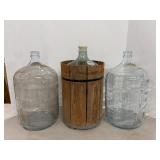 Vtg 5-gallon bottles & plastic bottle sealed with.