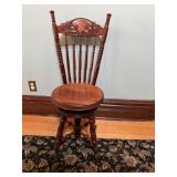 Antique Victorian - style swivel stool with claw.
