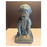 Cement statue of kneeling boy 7'W x 7' D x 12'H