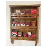 Wooden rack with antique spice cans