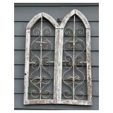 Gothic style arched window frames featuring...