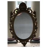 Plastic gold ornate mirror