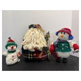 Folk art santa claus door stop & misc snowmen