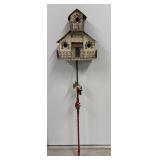 Birdhouse on a stake.