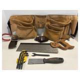 Carpenters leather tool belt with misc tools.