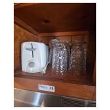 Contents of Cabinet: Toaster, Glasses