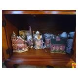 Contents of Lower Cabinet in China Cabinet: Christmas Houses ( The China on the Other Side of This Cabinet is Sold in Lot 116)