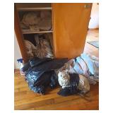 Ceramic Cat and closet of Linens