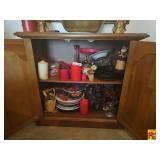 Decorative Items and Plates inside of Wooden Cabinet