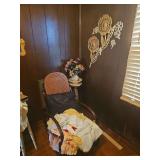 Cane Back Rocking Chair, Floral Wall Decor, and Side Table