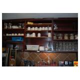 Restaurant Shelf Contents: Teas, Glasses, Mugs, and Pitchers