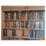 Contents of top 3 Shelves: Assorted VHS & DVD