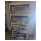 Plastic Storage Shelving Unit With Totes Of Light Bulbs