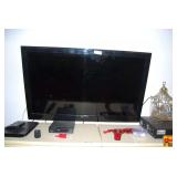 Element Flat Screen Television with JVC VCR, Magnavox DVD Player, and Philips Media Player