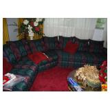 Sectional Sofa with Multi-Color Patterned Upholstery and Red Accent Pillows